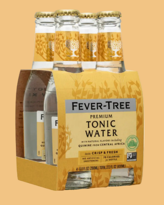 Pack of Fever-Tree tonic water bottles on a beige background