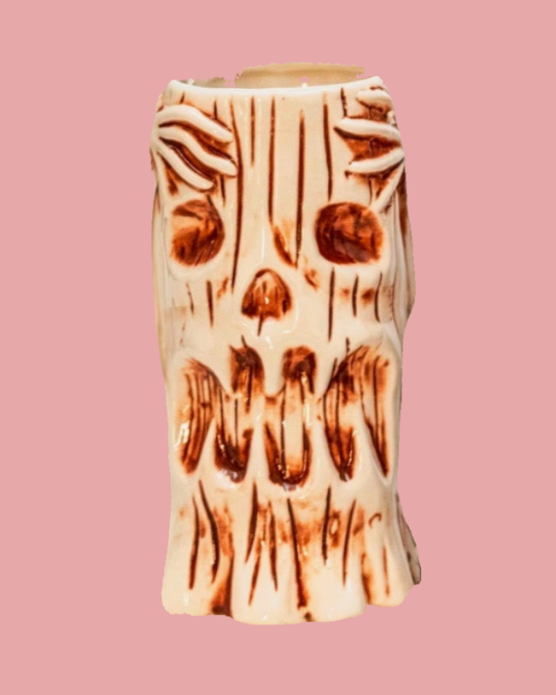 Decorative vase with tree bark pattern on a pink background