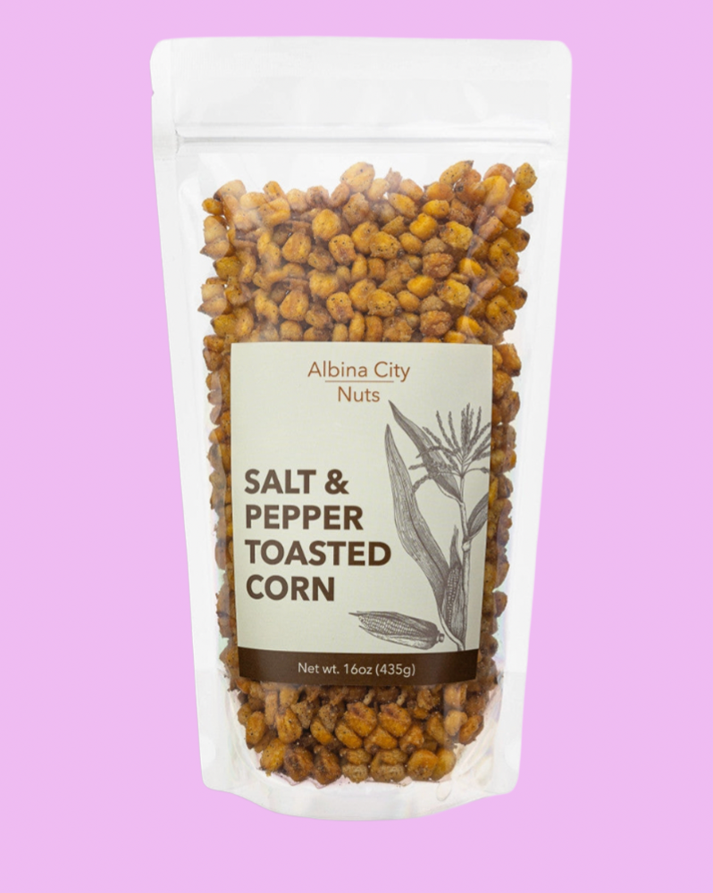 Packaged spicy toasted corn with Albina City Nuts label on a white background