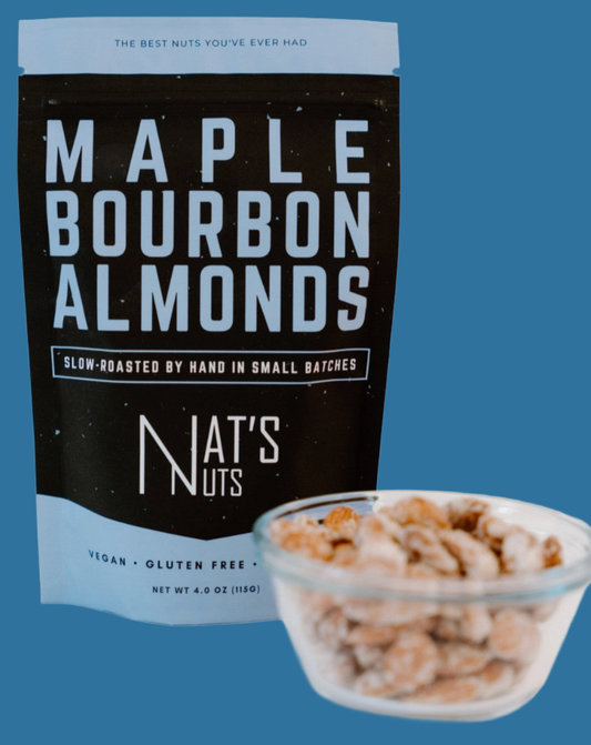 Bag of Maple Bourbon Almonds from Nat's Nuts with a bowl of almonds on a white background