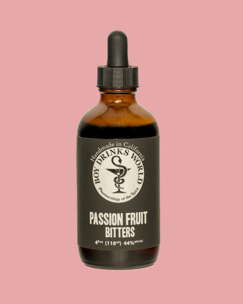 Bottle of passion fruit bitters with a black label on a pink background