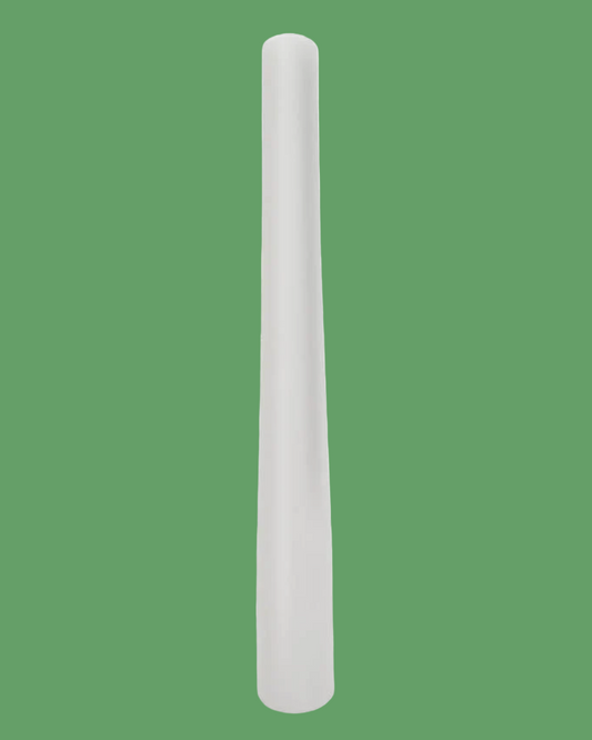 White cylindrical object on a green background