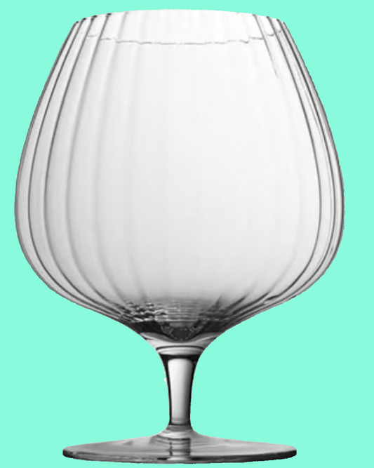 Clear glass wine glass on a solid background