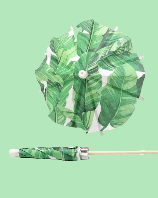 Green leaf-patterned pinwheel on a light green background