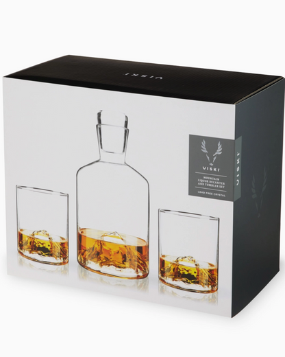 Whiskey decanter and glasses set with packaging on a white background