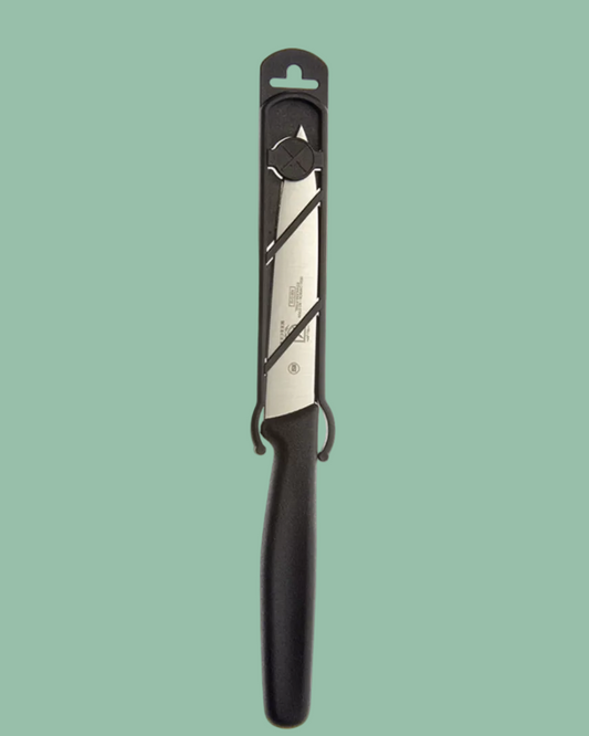 Knife with black handle on a green background