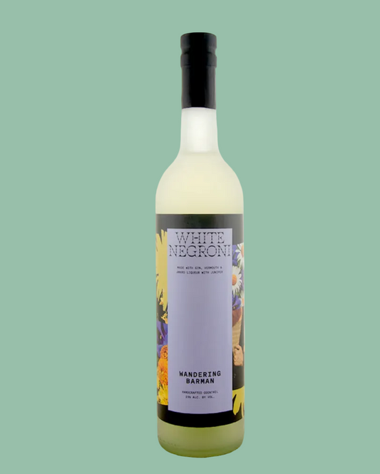 Bottle of White Negroni with a colorful label on a green background