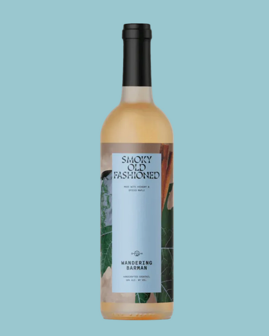 Bottle of 'Smoky Old Fashioned' on a light blue background