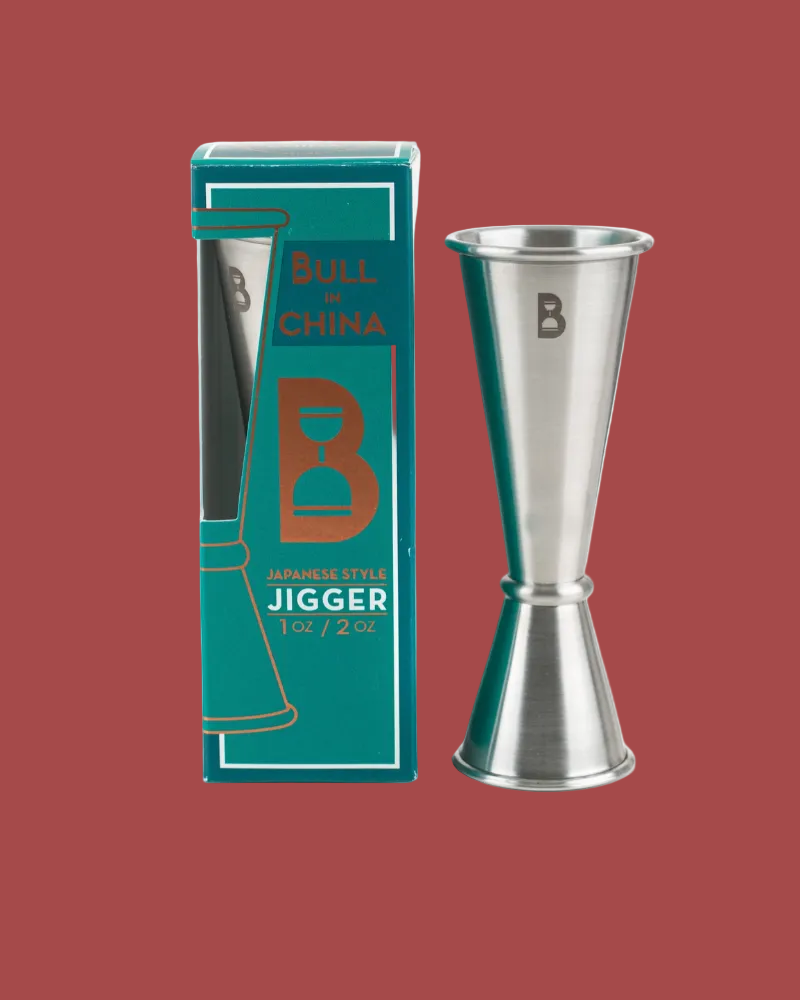 Silver jigger with packaging on a red background