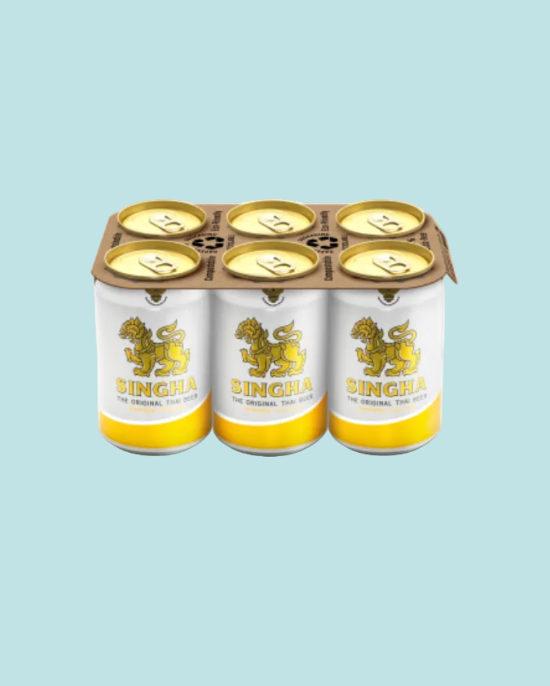 Six-pack of Singha beer cans on a white background