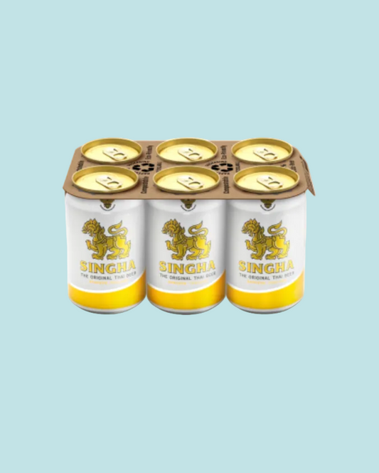 Six-pack of Singha beer cans on a white background