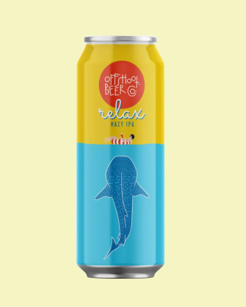 Beer can with yellow and blue design featuring a shark illustration on a light yellow background