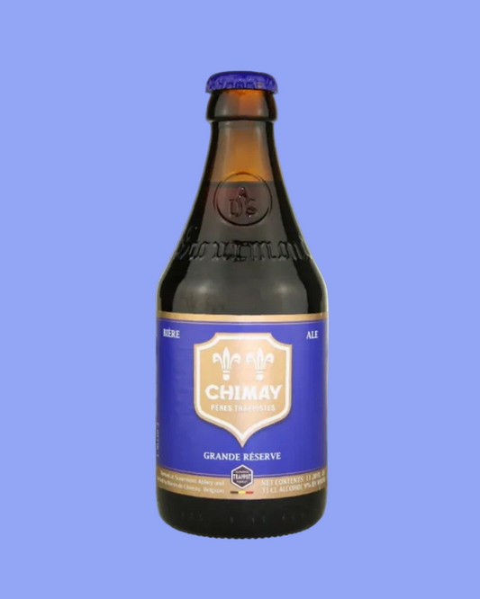 Chimay beer bottle with blue label on a white background
