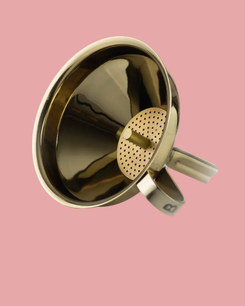 Gold-colored metal strainer on a white background