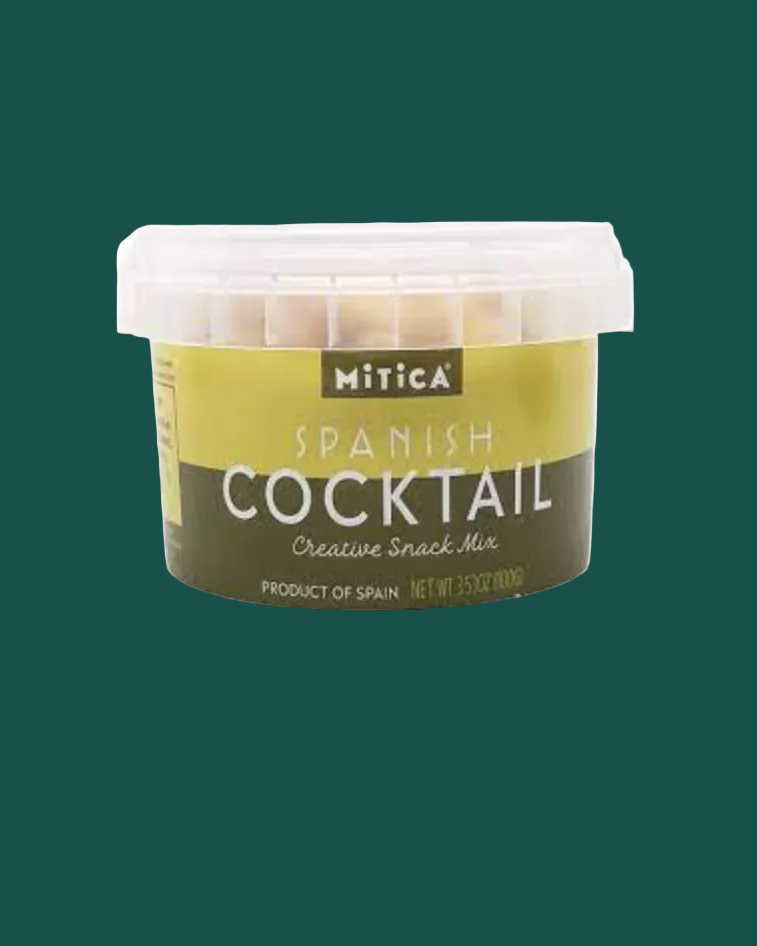Container of Mitica Spanish Cocktail snack mix on a green background