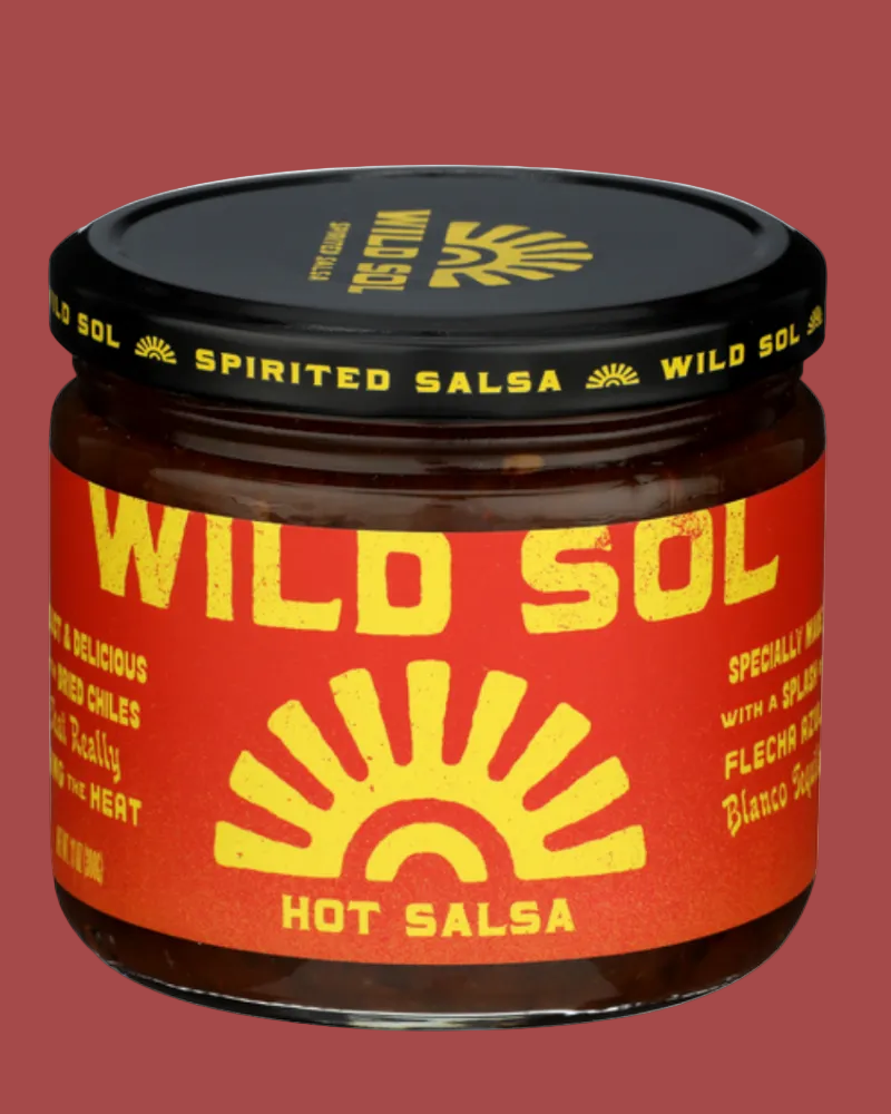 Jar of Wild Sol hot salsa with red label and black lid on a white background