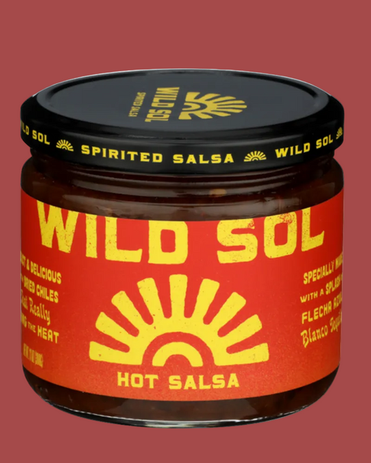 Jar of Wild Sol hot salsa with red label and black lid on a white background