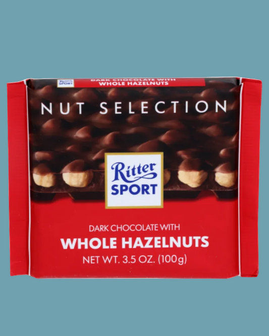 Ritter Sport chocolate bar packaging with dark chocolate and whole hazelnuts on a white background