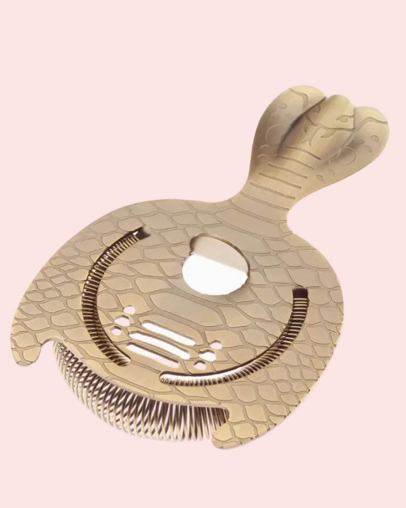 Metallic bar strainer with snake design on a white background