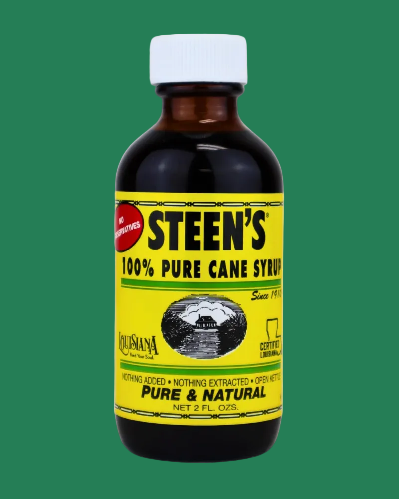 Steen's 100% Pure Cane Syrup bottle on a green background