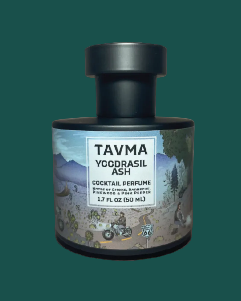 Perfume bottle with a label featuring artistic designs and text on a beige background