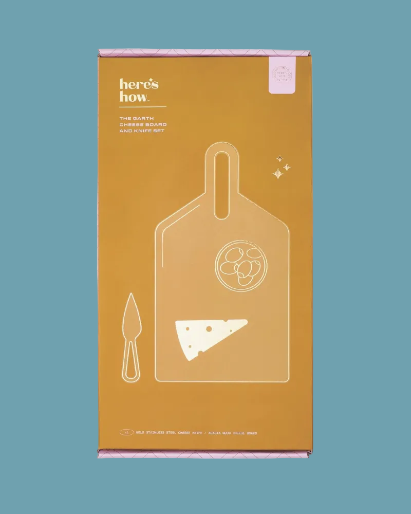 Orange packaging box with white illustrations of a cutting board and knife on a teal background