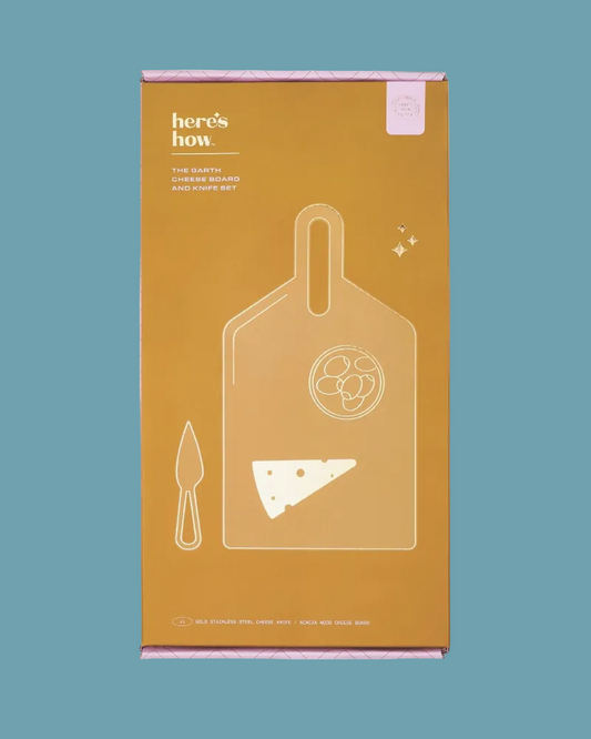 Orange packaging box with white illustrations of a cutting board and knife on a teal background