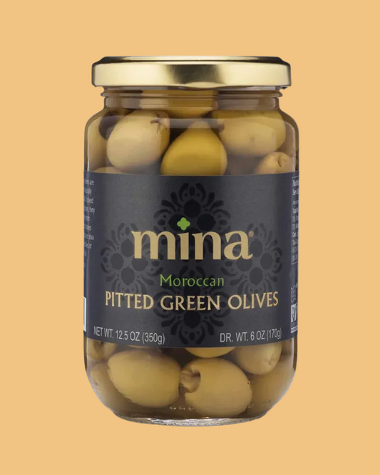 Jar of Mina Moroccan Pitted Green Olives on a beige background
