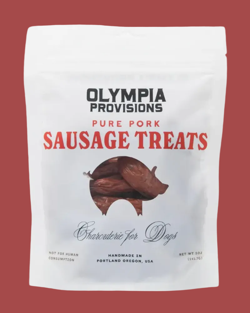 Package of Olympia Provisions pure pork sausage treats for dogs on a white background