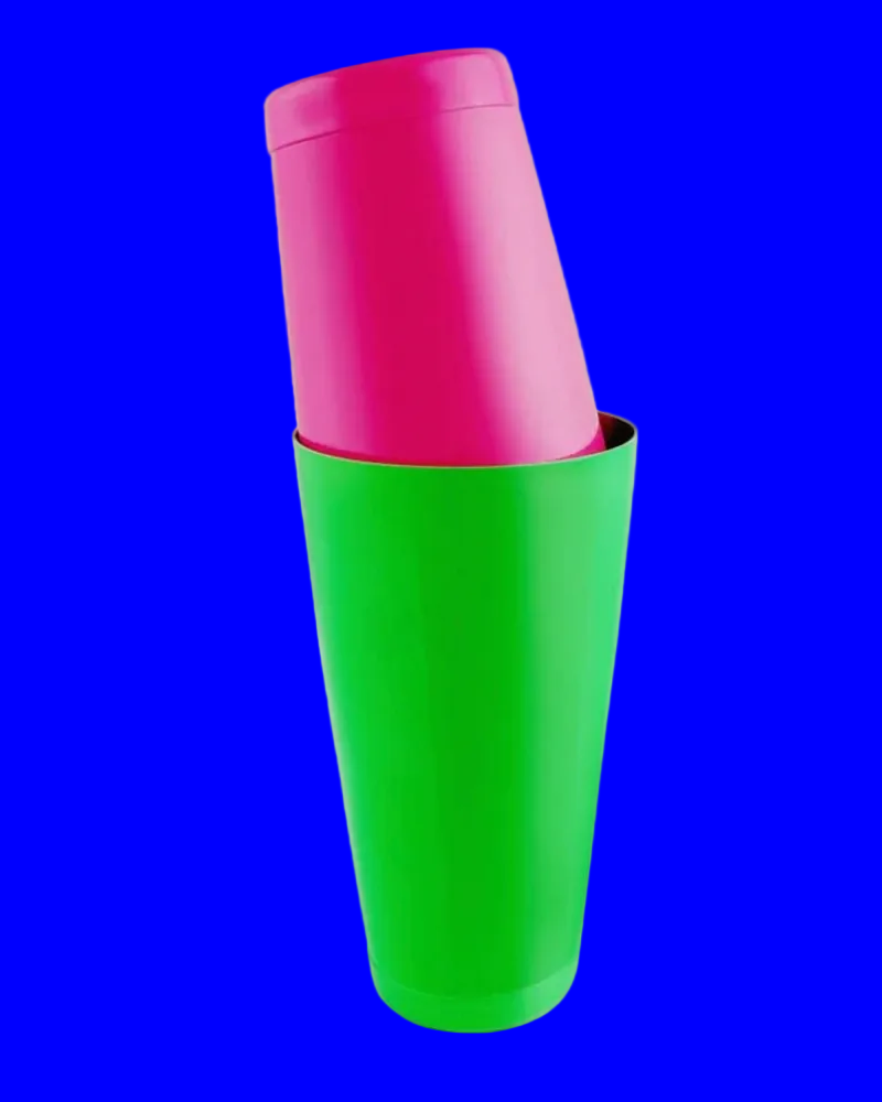 Green and pink plastic cups on a blue background