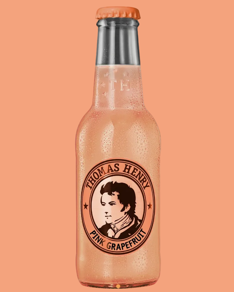 Bottle of Thomas Henry Pink Grapefruit soda on a dark background