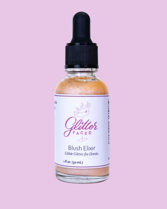Bottle of Glitter Faced Blush Elixir on a white background