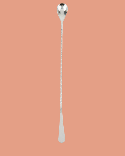 Silver spoon with a long handle on a white background
