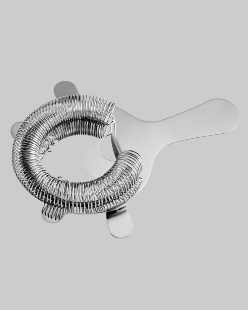 silver metal strainer on a grey background