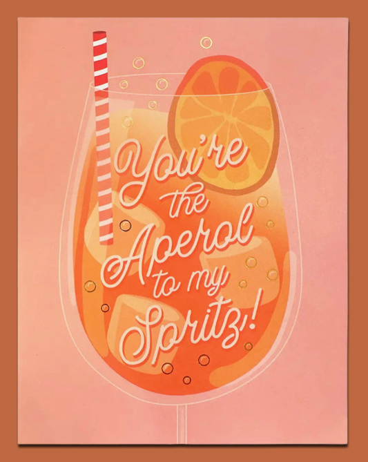 Illustration of a cocktail glass with text 'You're the Aperol to my Spritz!' on a pink background