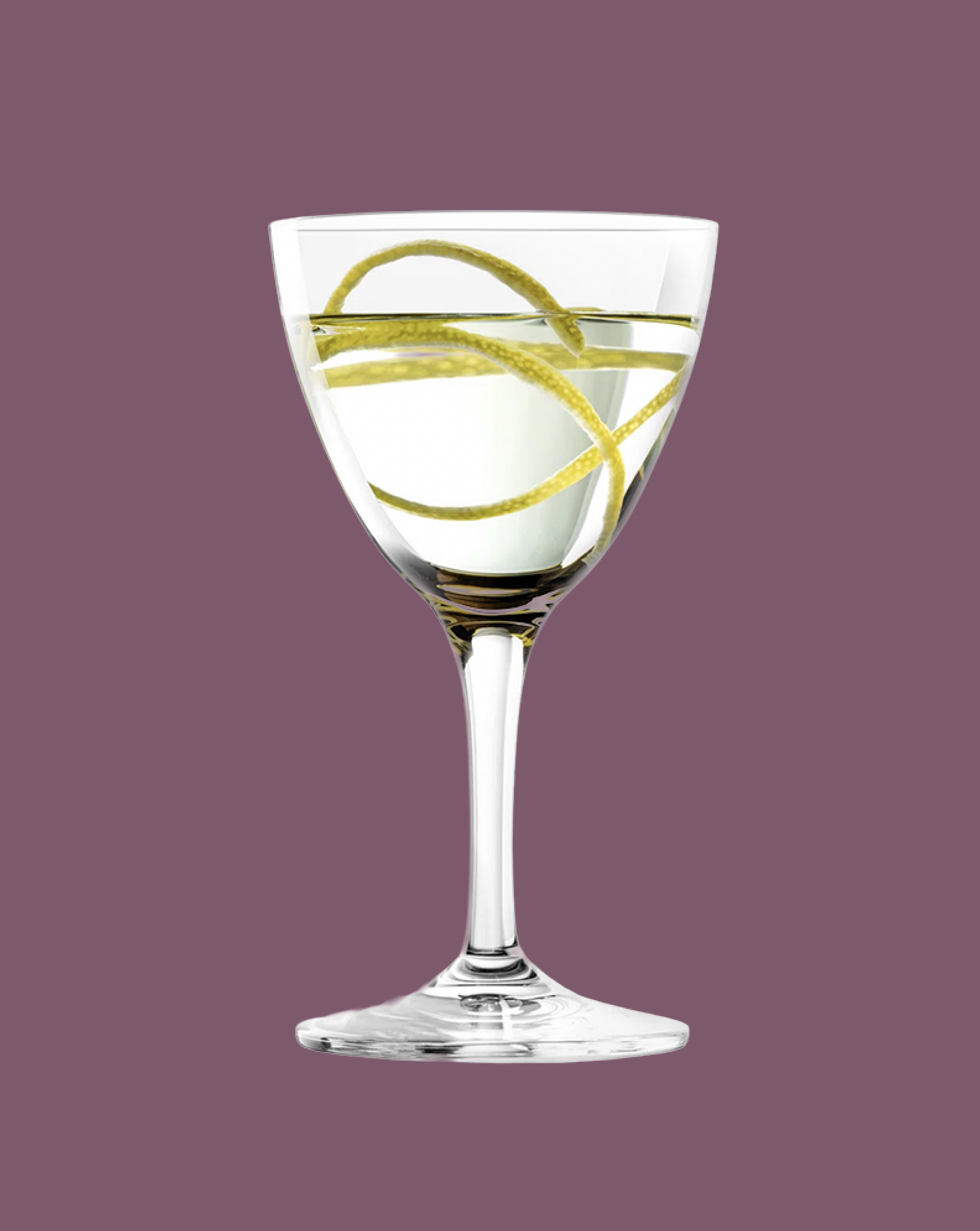 Cocktail glass with a lemon twist on a purple background