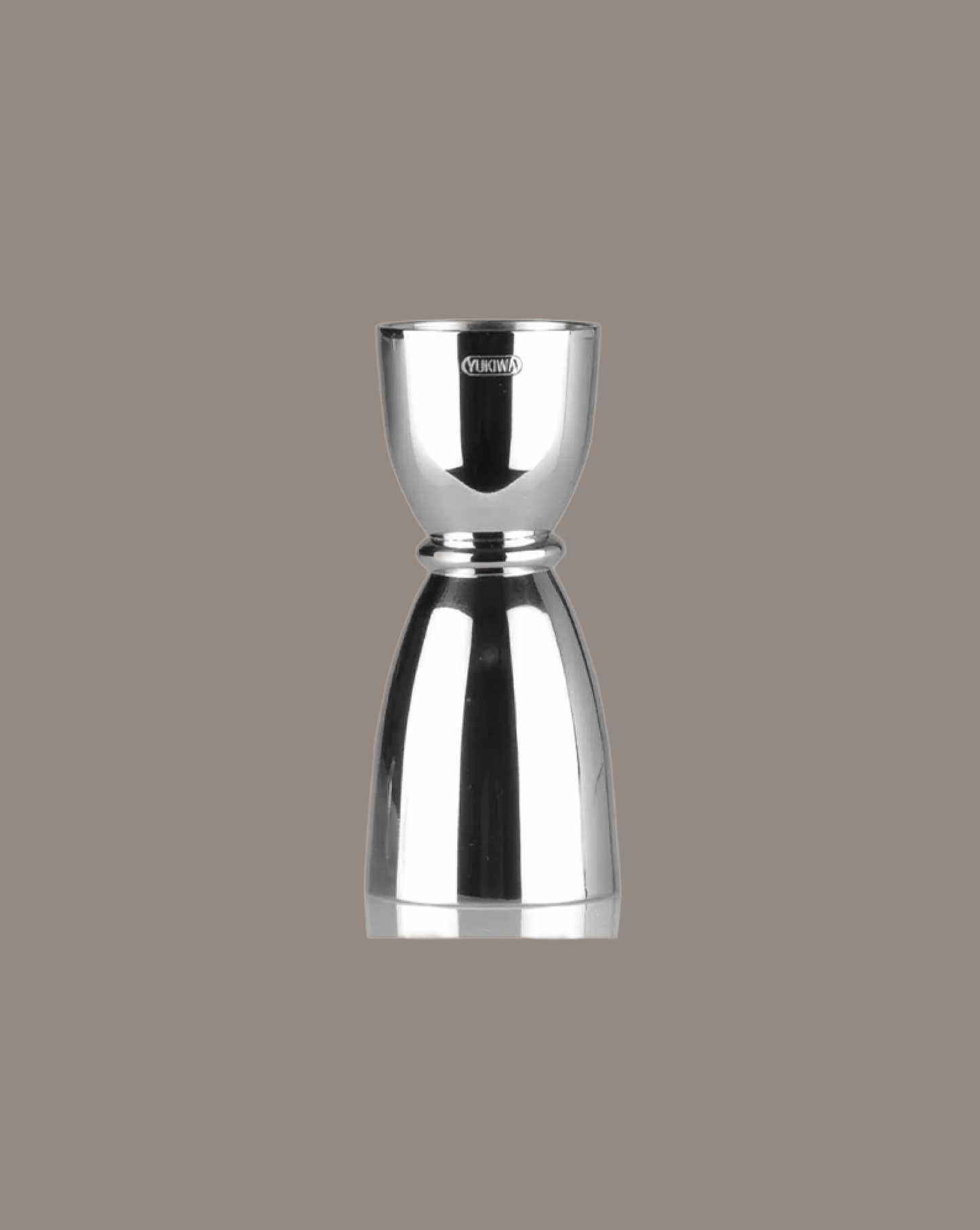 Silver jigger on a gray background