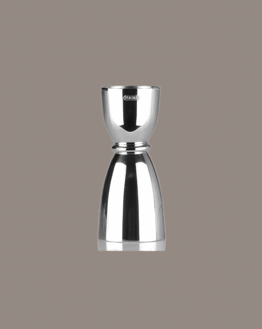 Silver jigger on a gray background