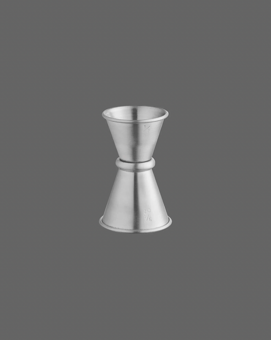 Metallic jigger on a gray background