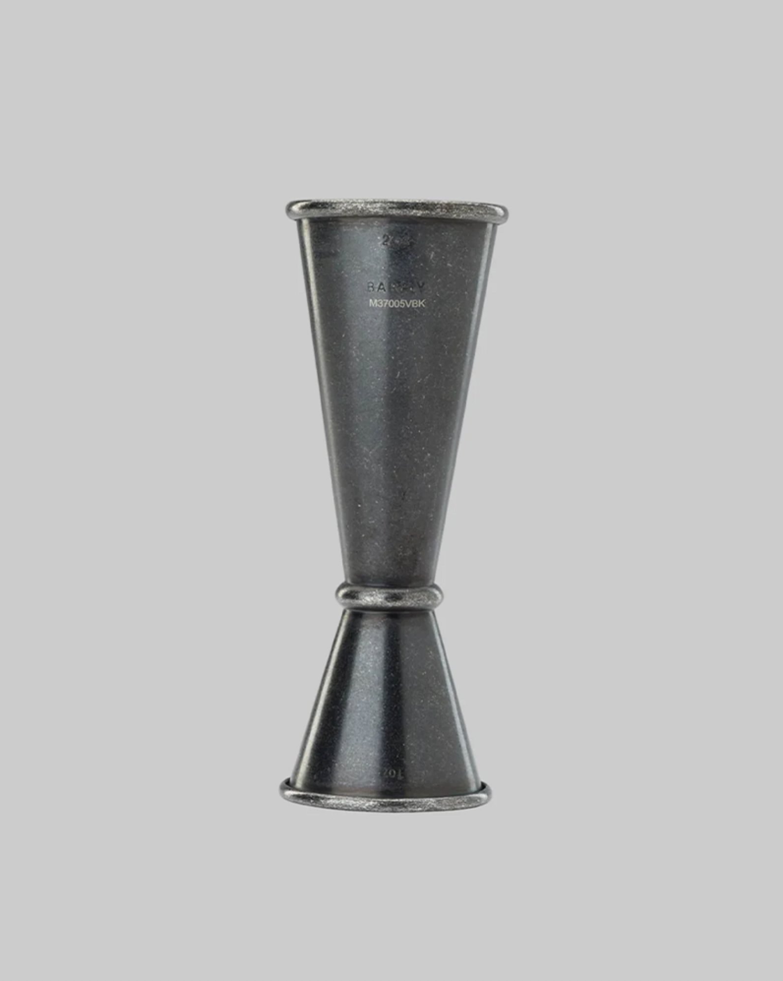 Metallic jigger on a gray background