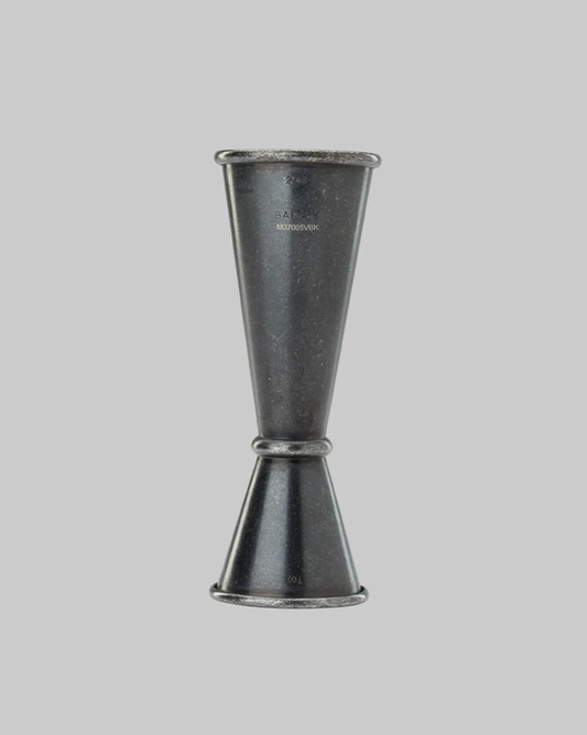 Metallic jigger on a gray background