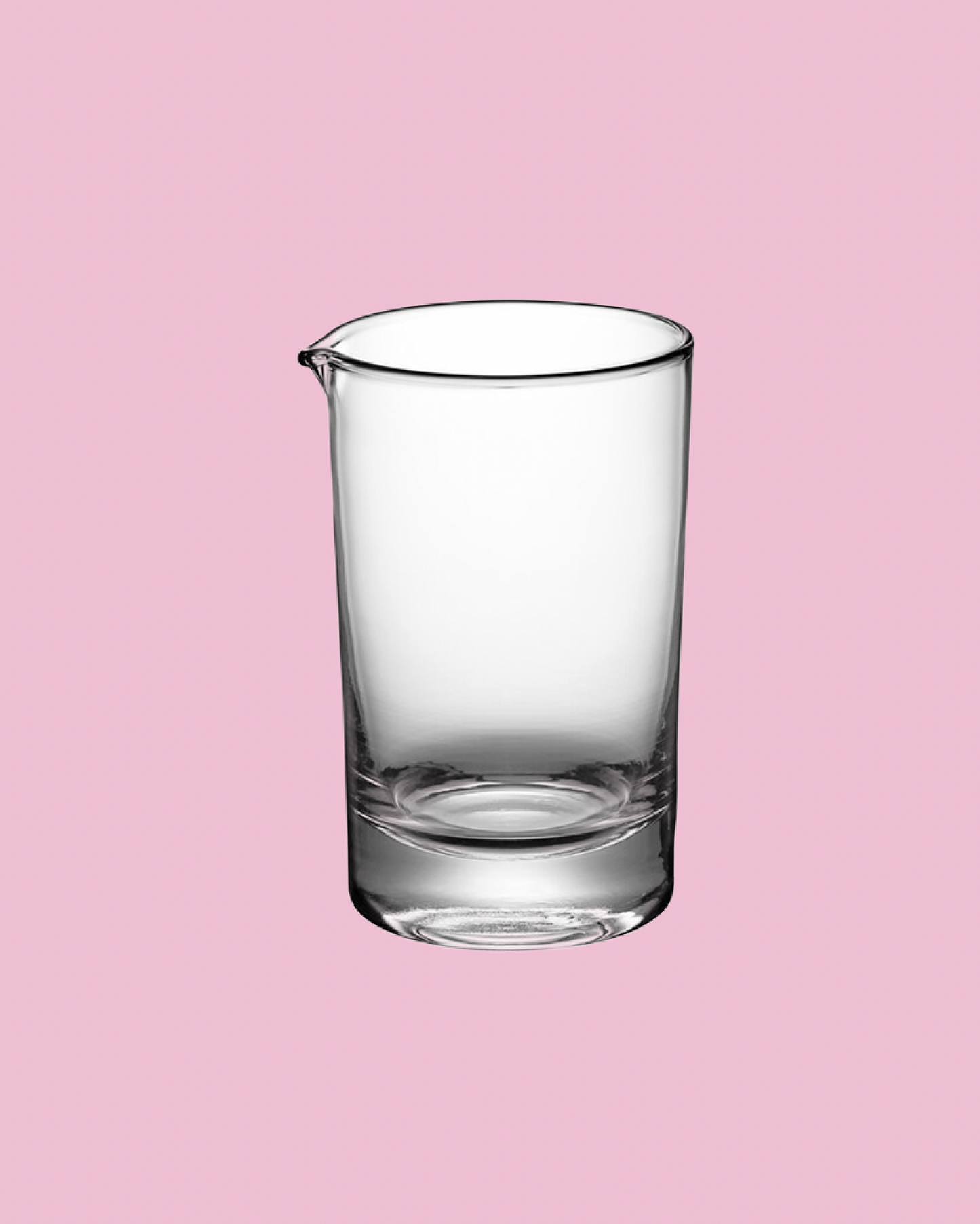 Clear glass beaker on a pink background