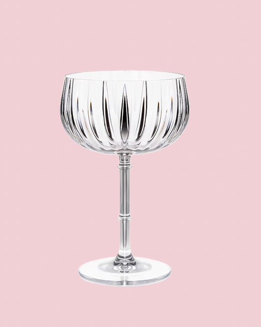 Clear glass with vertical stripes on a pink background