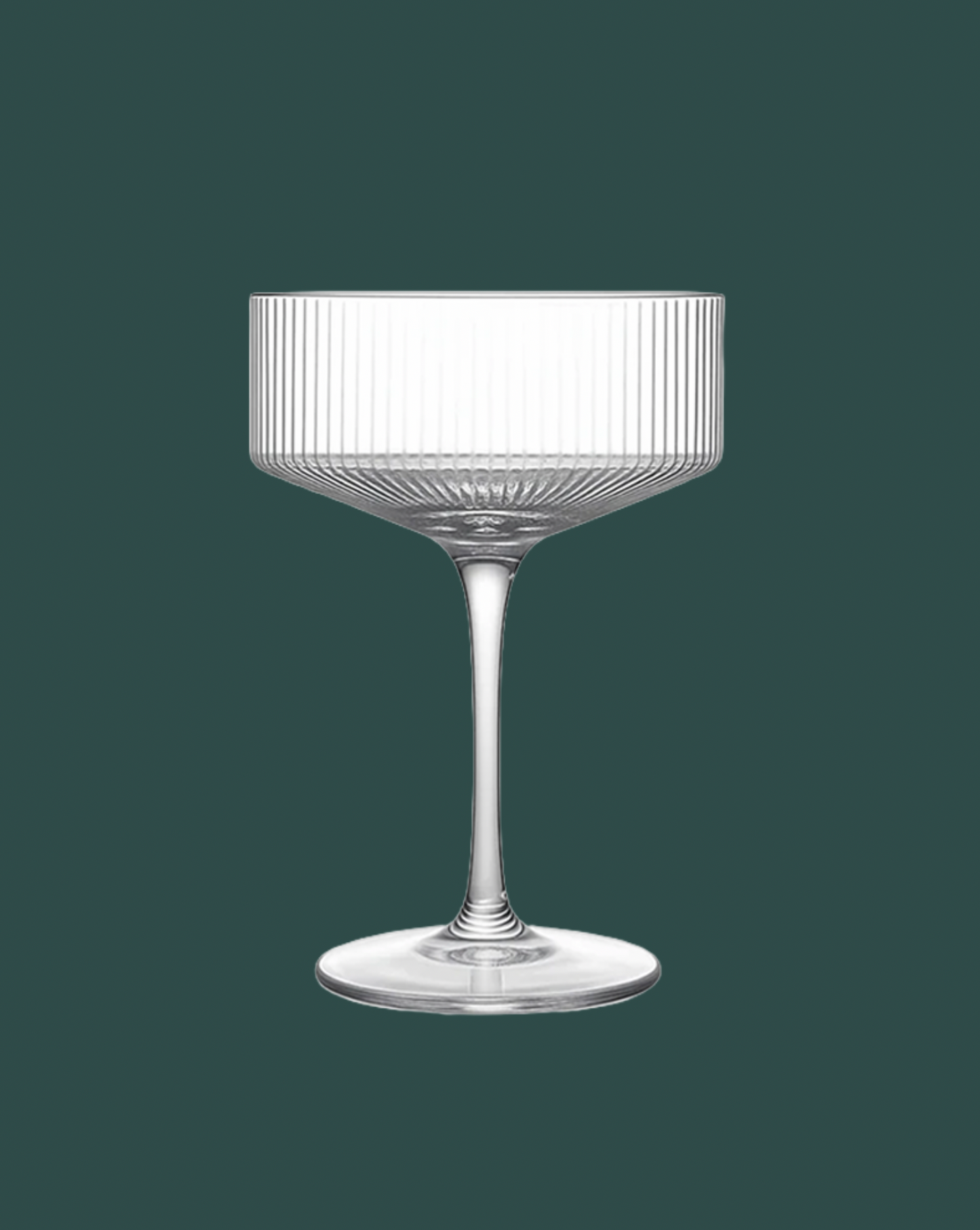 Clear glass with ribbed design on a dark green background