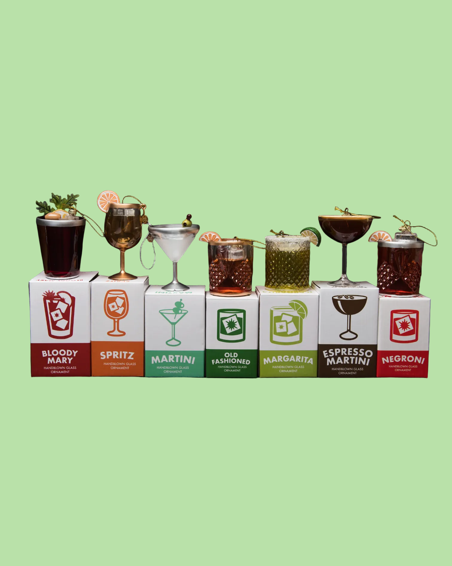 Set of cocktail boxes with corresponding drink illustrations on a black background