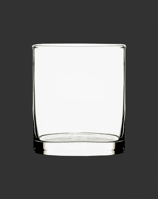 Clear glass tumbler on a black background