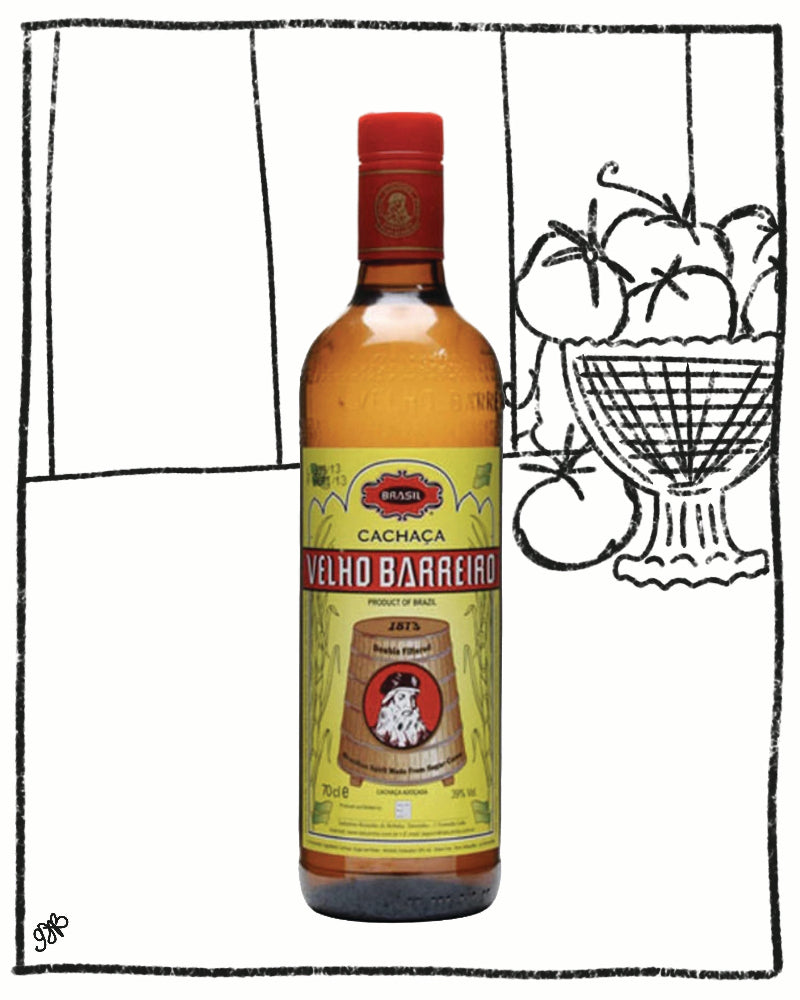 Bottle of Velho Barreirado Cachaca with a decorative background