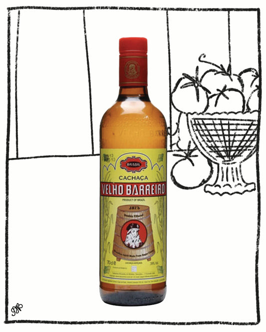 Bottle of Velho Barreirado Cachaca with a decorative background