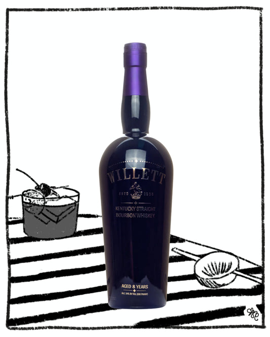 Willett bourbon whiskey bottle with a cocktail in the background