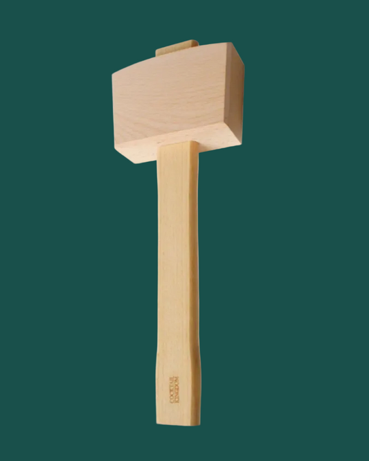 A wooden mallet hammer with a light natural wood head and handle, shown vertically against a solid dark green background.